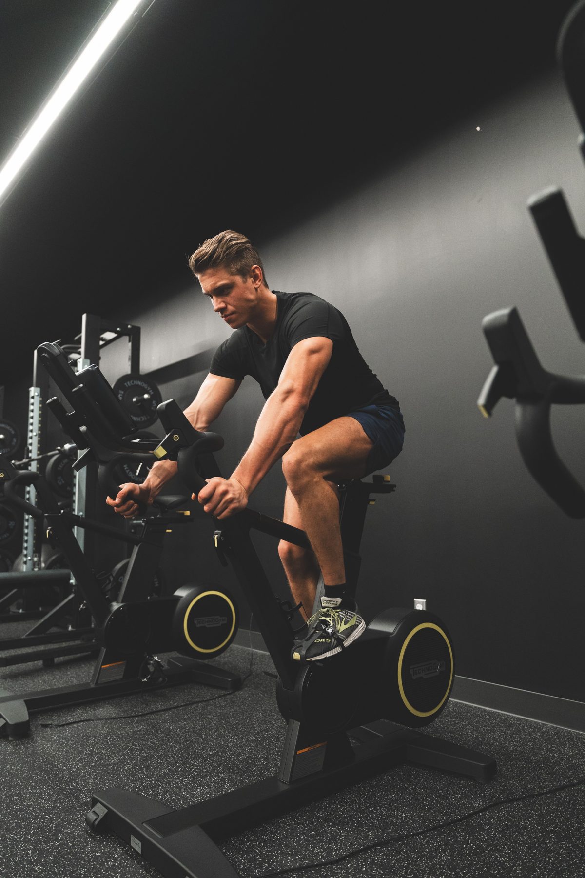 Leo, spin and cardio coach, on a bike