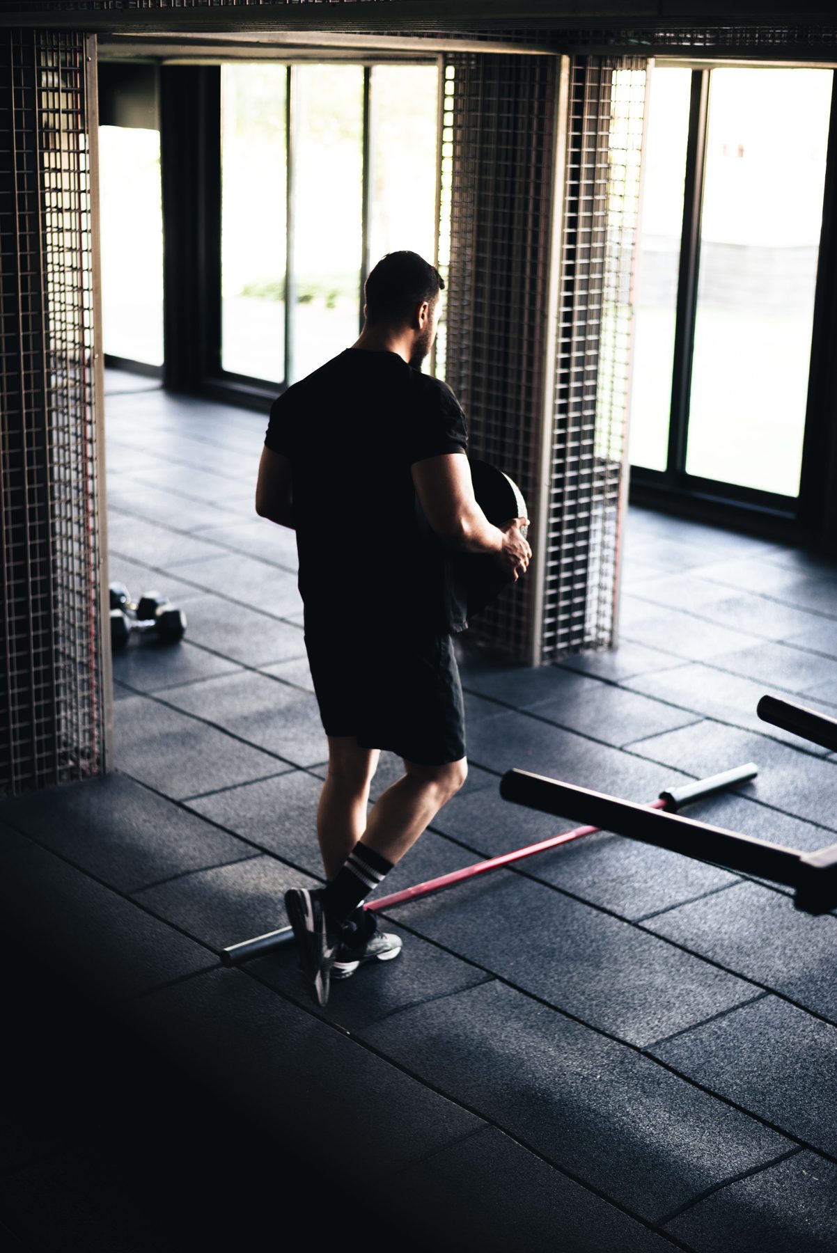 Ben, mobility coach, carrying a plate across the floor