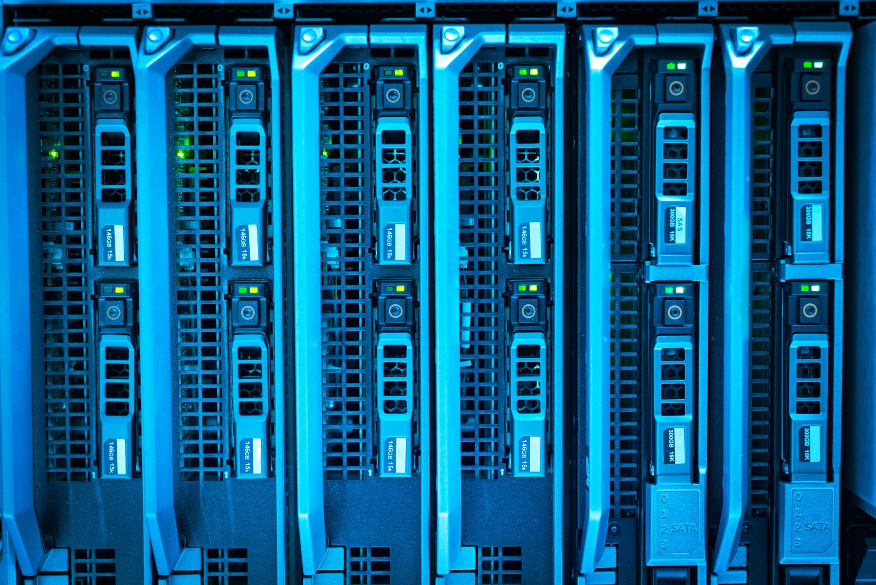 Rows of lit server drives in a rack